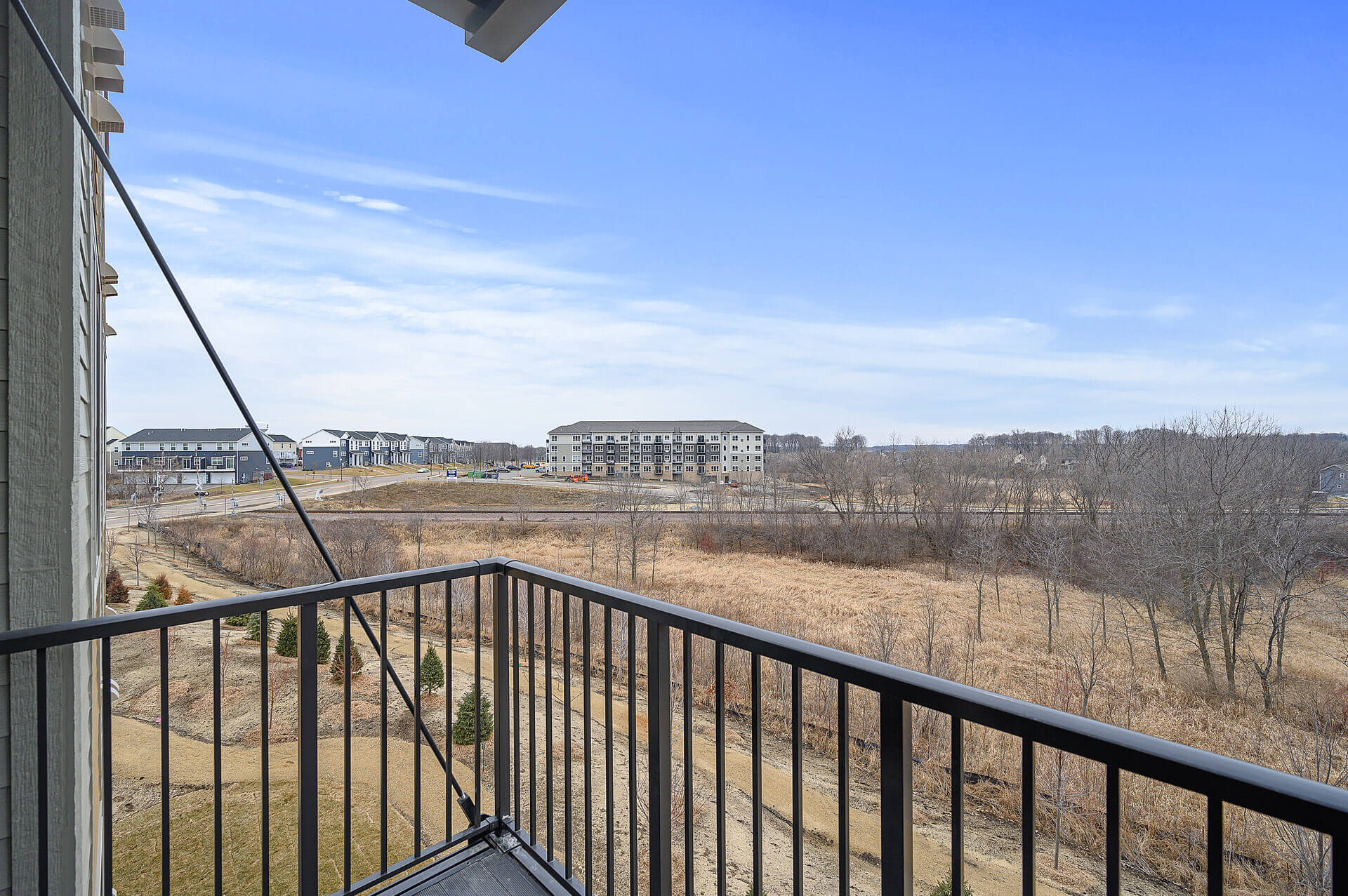 outside on balcony for Clover floor plan
